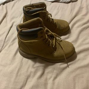 Very worn steel toe boots